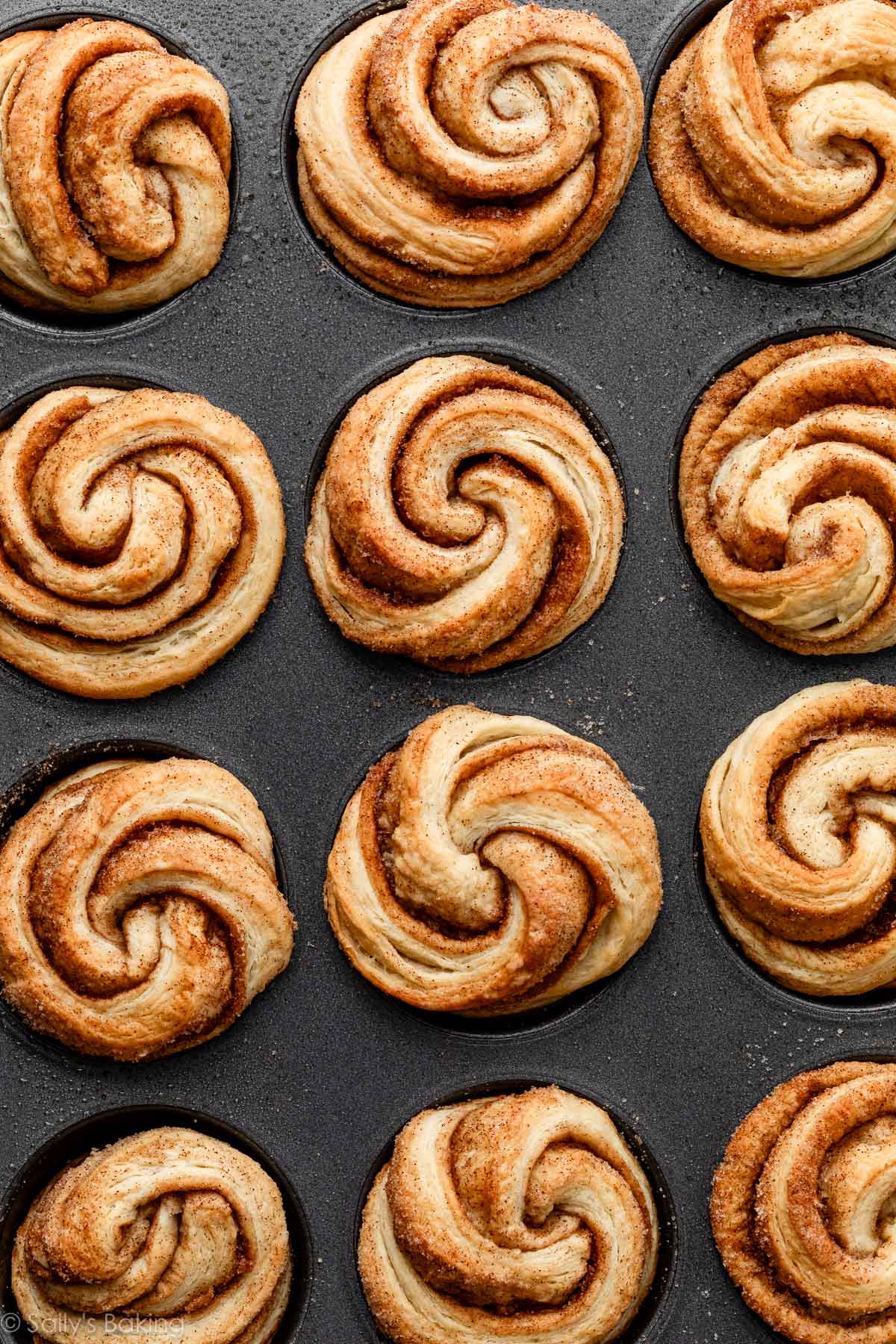 overhead image of baked cruffin pastries in muffin pan.