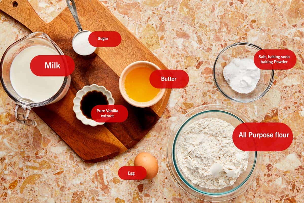 Ingrédients pour les Paffles exposés sur une table, y compris de la farine, du sucre, des œufs et du beurre, prêts à être cuisinés.